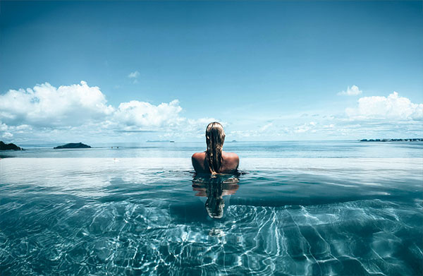Floating beachfront club with infinity pool